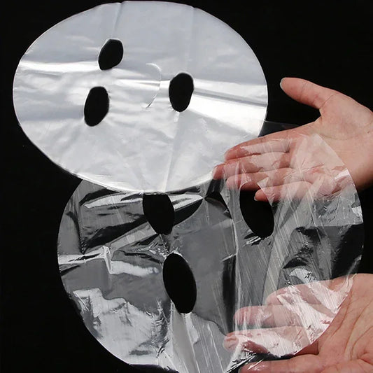 100 unidades de mascarillas desechables transparentes para el rostro, envoltura de plástico, limpiador facial completo, pegatinas para el cuello, herramientas de maquillaje y belleza facial.